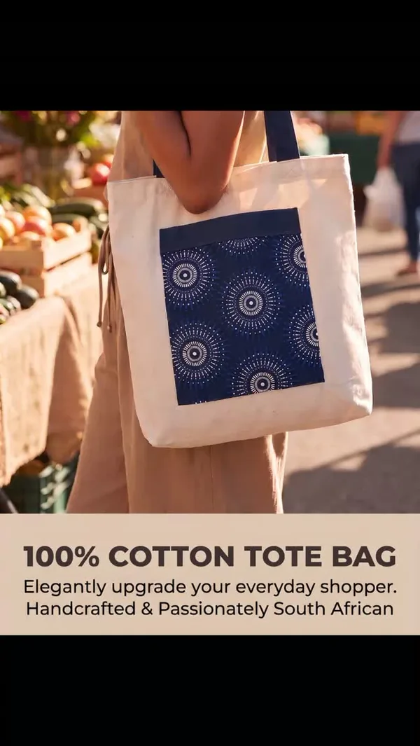 Cotton tote bag with blue shweshwe print panel at a market