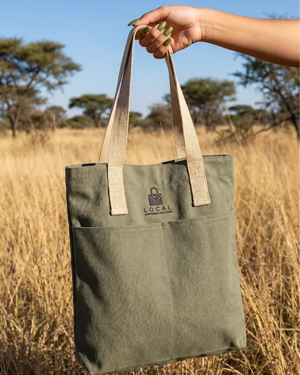 Heavy-duty olive cotton tote bag photographed in natural light